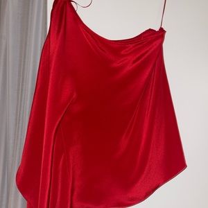Selling a red, off one shoulder, blouse